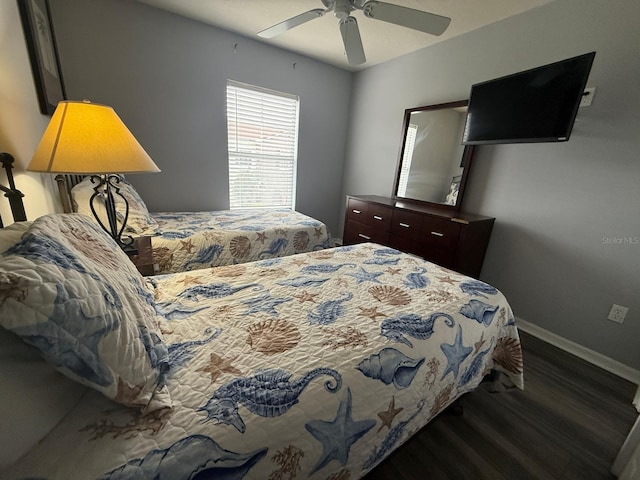 bedroom featuring dark hardwood / wood-style flooring and ceiling fan