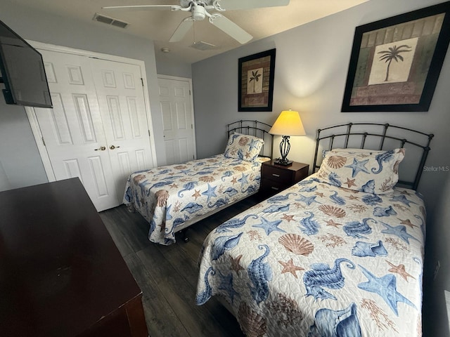 bedroom featuring dark hardwood / wood-style floors, a closet, and ceiling fan