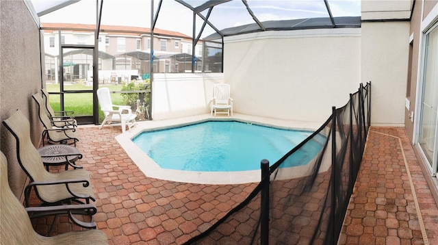 view of pool with a lanai and a patio area