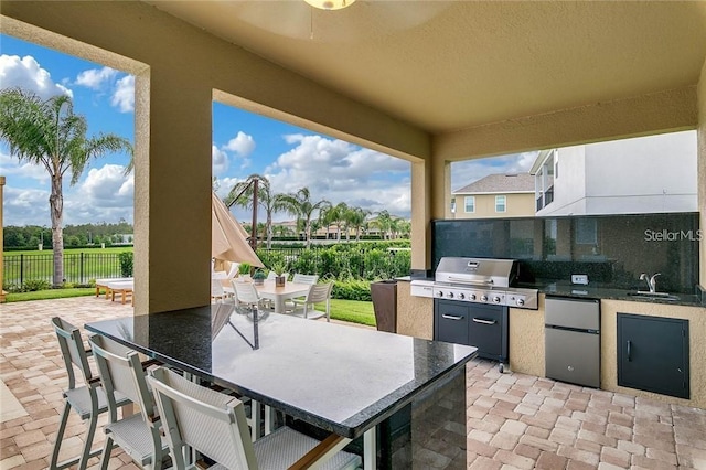 view of patio / terrace featuring sink and area for grilling