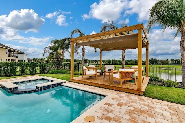 view of swimming pool with a deck with water view and an in ground hot tub