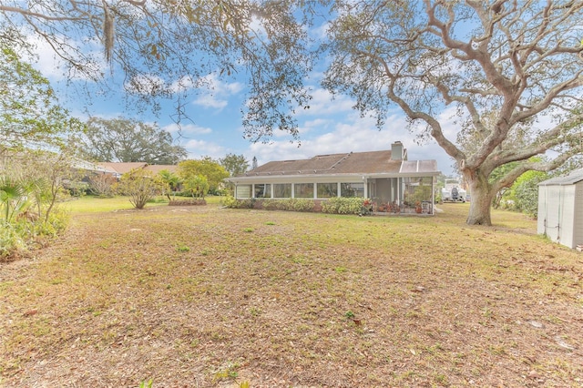 back of house featuring a yard