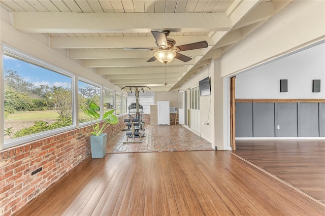 unfurnished sunroom with beamed ceiling and ceiling fan