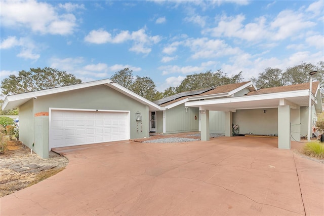 ranch-style house featuring a garage