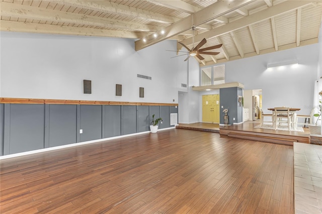 interior space featuring high vaulted ceiling, ceiling fan, hardwood / wood-style floors, and wood ceiling