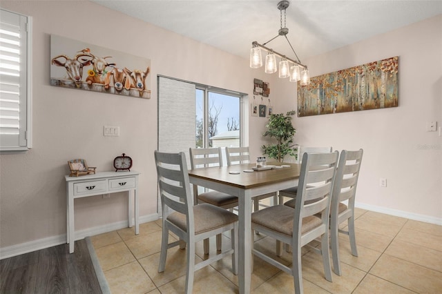 dining area featuring light tile patterned flooring