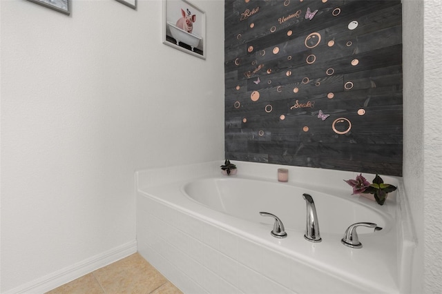 bathroom featuring tile patterned flooring and tiled tub