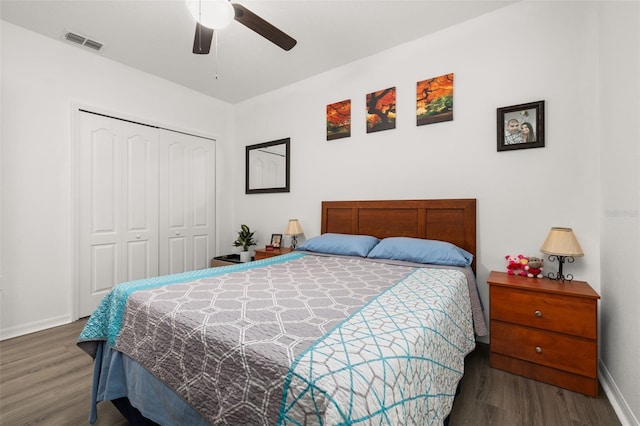 bedroom featuring a closet, ceiling fan, and dark hardwood / wood-style flooring