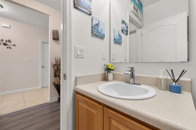 bathroom featuring hardwood / wood-style floors and vanity