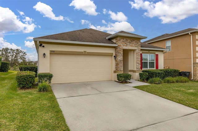 view of front facade with a front yard and a garage