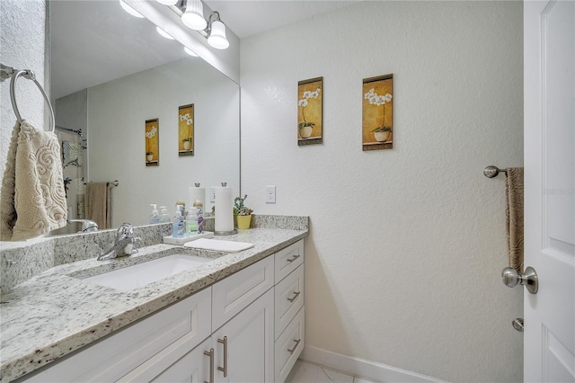 bathroom with vanity and tile patterned flooring