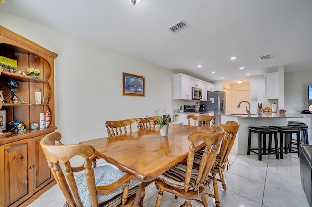 dining space with sink