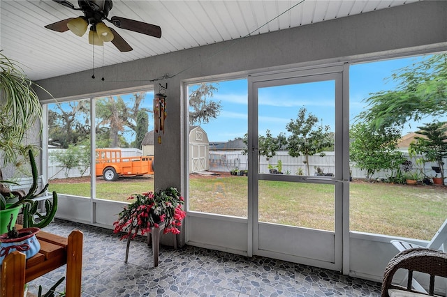 sunroom / solarium with ceiling fan