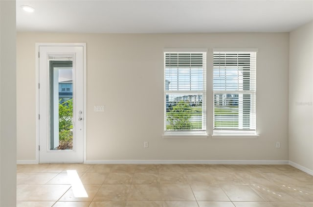 entrance foyer with plenty of natural light and light tile patterned floors