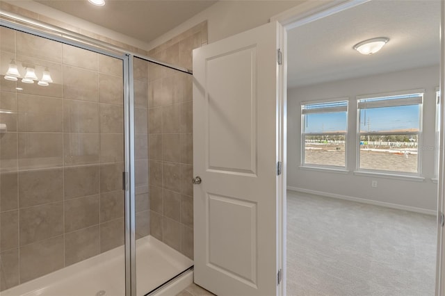 bathroom with a shower with shower door