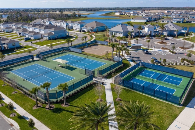 birds eye view of property with a water view