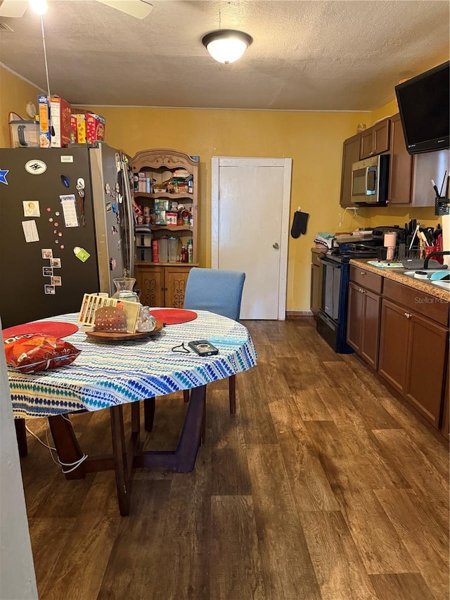 704 N 8th St, Haines City, FL 33844 - dining room featuring dark wood-style floors