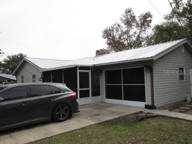 exterior space featuring a sunroom