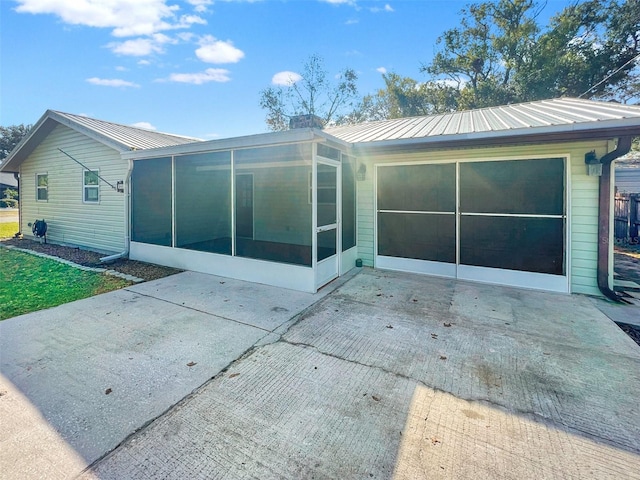 rear view of house with a sunroom