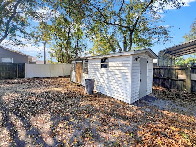 view of outdoor structure with a carport