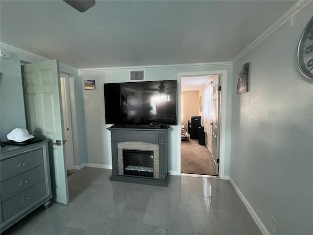 living room featuring ornamental molding and a stone fireplace