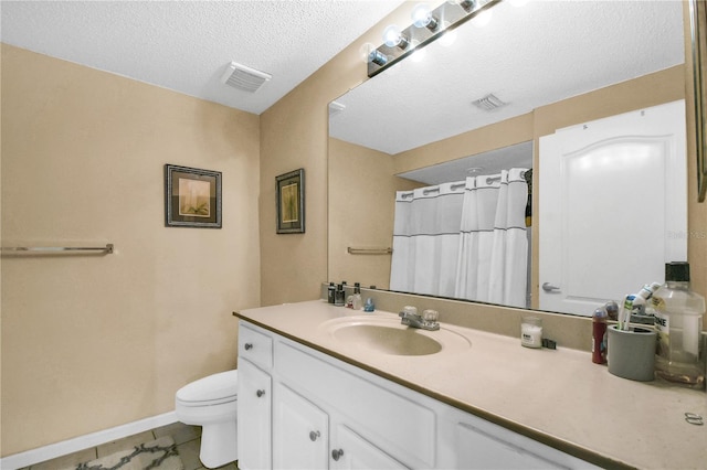 bathroom featuring a textured ceiling, tile patterned floors, vanity, toilet, and a shower with shower curtain