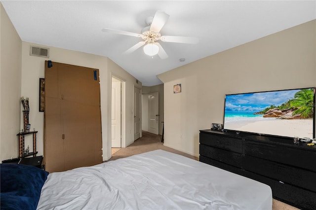 bedroom featuring ceiling fan and light colored carpet