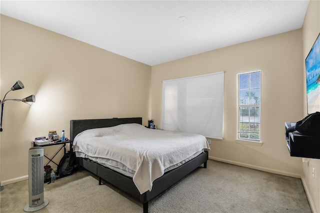 bedroom featuring light colored carpet