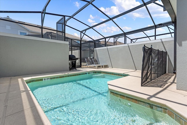 view of pool featuring a lanai, grilling area, and a patio area