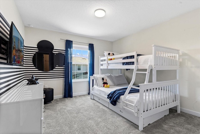 carpeted bedroom with a textured ceiling