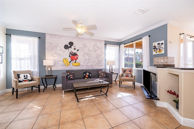 living room featuring light tile patterned floors, baseboards, visible vents, a ceiling fan, and crown molding