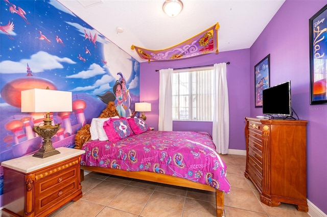 bedroom featuring baseboards and light tile patterned floors