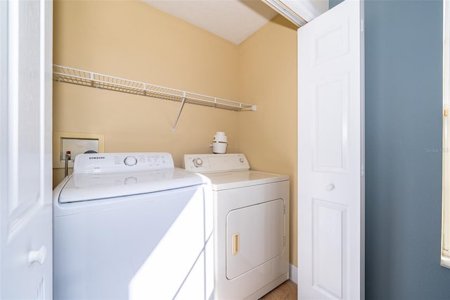 laundry room featuring washer and dryer and laundry area