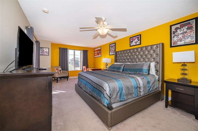 bedroom featuring baseboards and light colored carpet