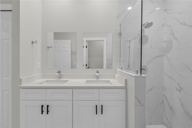 bathroom featuring vanity and a tile shower