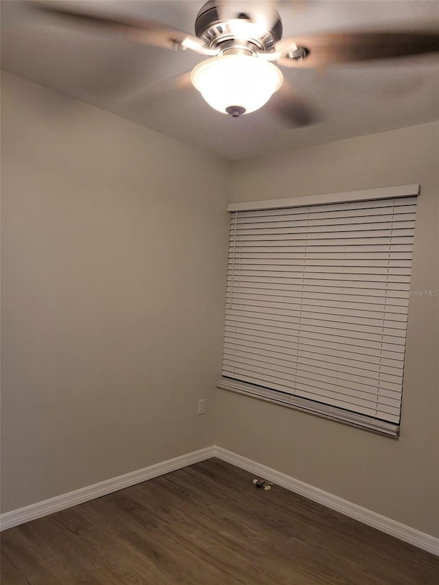 unfurnished room featuring dark hardwood / wood-style flooring and ceiling fan