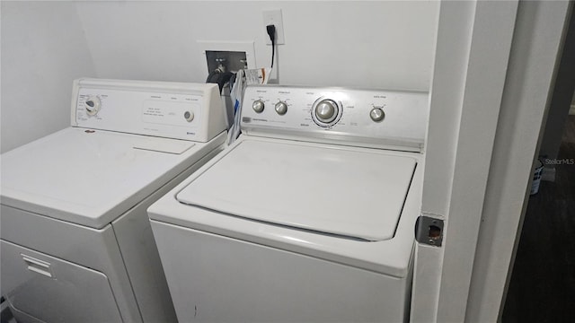 clothes washing area featuring washing machine and clothes dryer