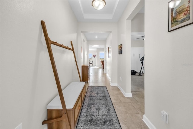 hall with light tile patterned floors