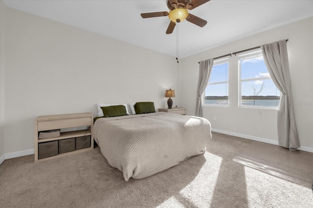 bedroom with light carpet and ceiling fan