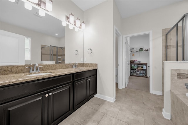 bathroom with independent shower and bath, tile patterned flooring, and vanity