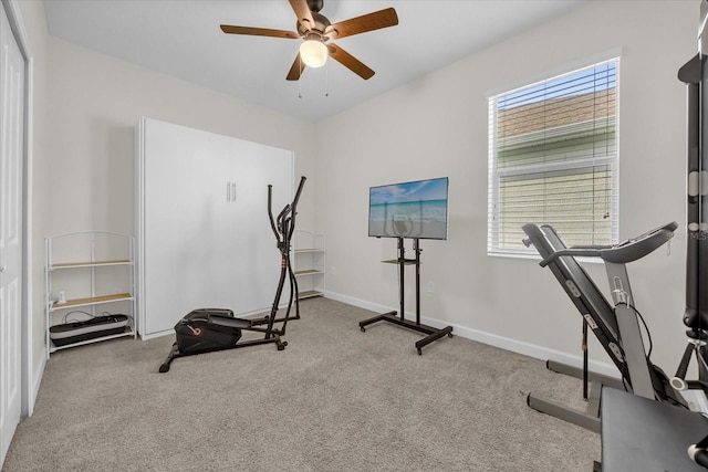 workout room with a healthy amount of sunlight, light colored carpet, and ceiling fan