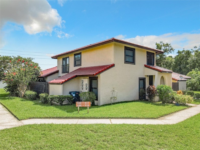 view of front of property with a front lawn and central air condition unit