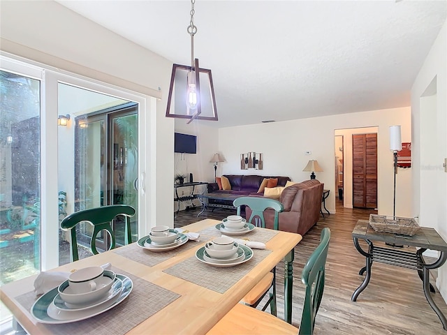 dining space featuring hardwood / wood-style flooring