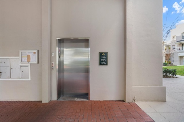 view of exterior entry with elevator