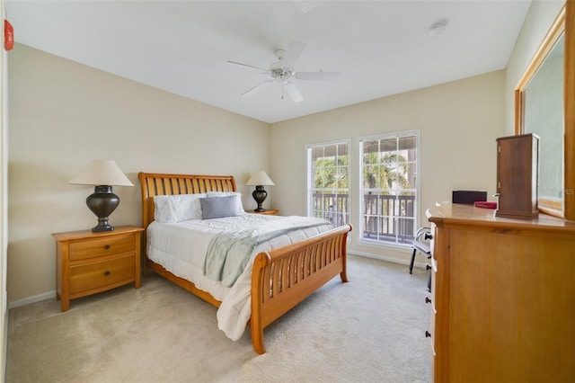 bedroom featuring ceiling fan, light colored carpet, and access to outside