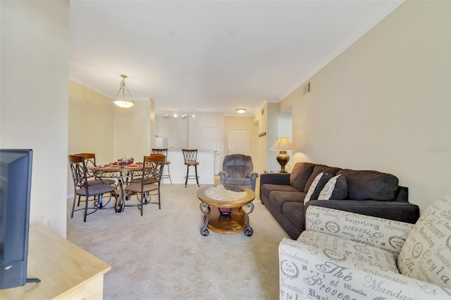 carpeted living room with crown molding