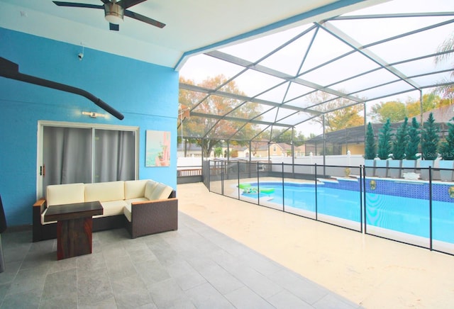 view of swimming pool featuring outdoor lounge area, a patio area, ceiling fan, and a lanai