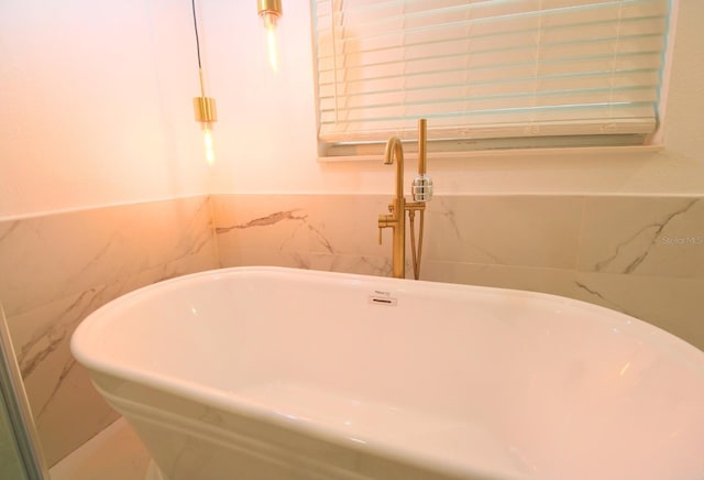 interior space featuring a tub to relax in