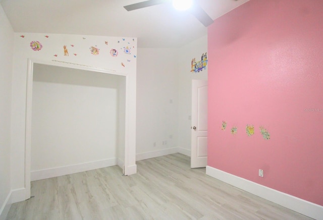 empty room with light hardwood / wood-style floors and ceiling fan