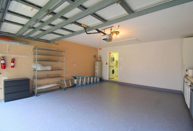 garage featuring stacked washing maching and dryer, water heater, and a garage door opener